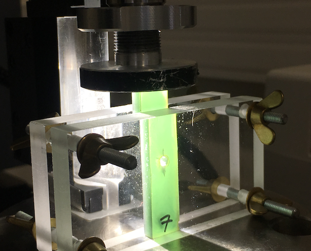 Damage phase-field approach vs. Cohesive zone model for double cleavage drilled compression fracture test